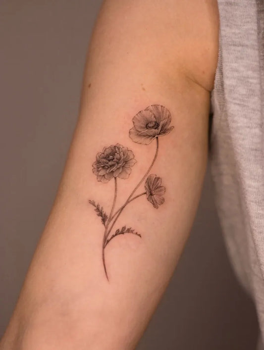 Small Black and Grey Poppy Flowers Tattoo on Women Arm by @suyscene