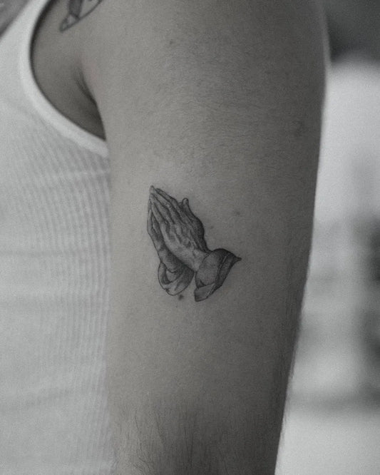 Small Black and Grey Praying Hands with Dove Tattoo on Men Upper Arm by @romysant