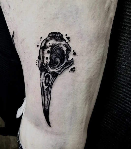 Small Black and Grey Raven Skull on Men Leg Tattoo by @ink_melon_tattoos