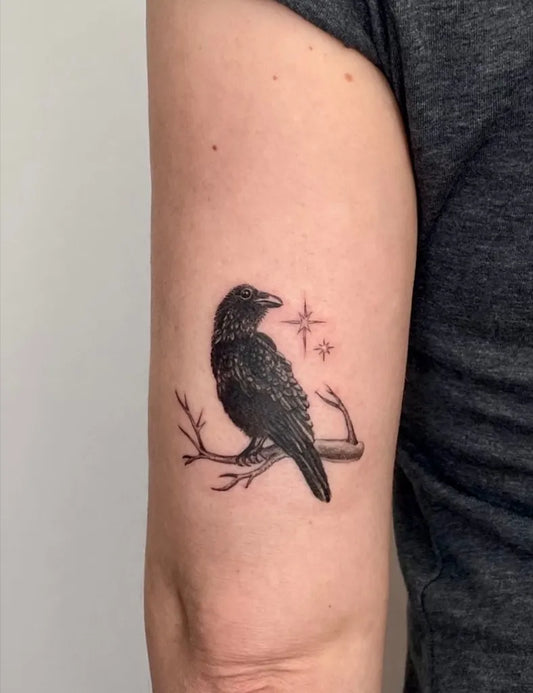 Small Black and Grey Raven on Branch on Women Arm Tattoo by @carolinavoldt
