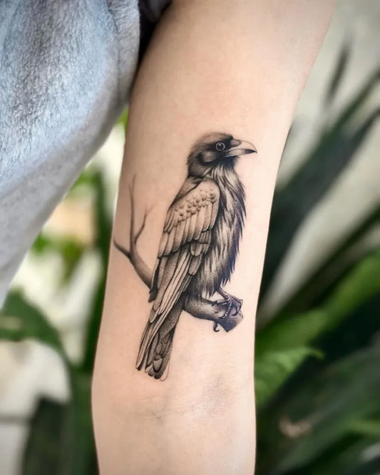 Small Black and Grey Raven on Women Arm Tattoo by @baronart_john