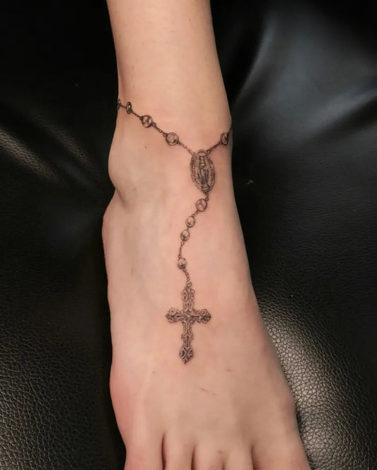 Small Black and Grey Rosary Beads and Cross Tattoo on Women Ankle by @cowgurl_bebop