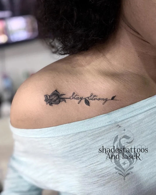 Small Black and Grey Rose and Script Tattoo on Women Collarbone by @shadestattoosandlaser