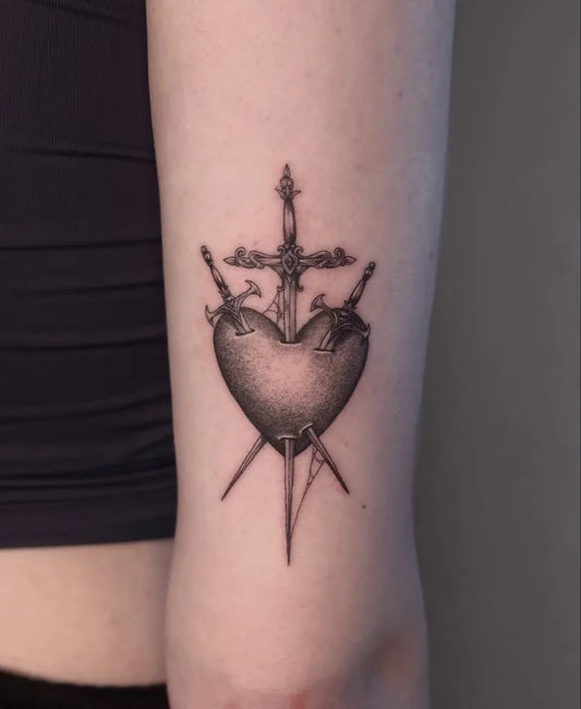 Small Black and Grey Sacred Heart with Swords on Women Arm Tattoo by @em4eternity