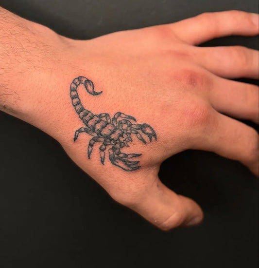 Small Black and Grey Scorpion on Men Hand Tattoo by @sge_ink