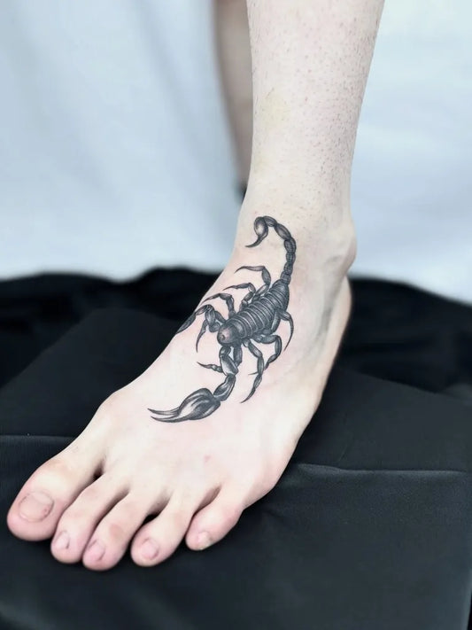 Small Black and Grey Scorpion on Women Foot Tattoo by @mizuchi.ink
