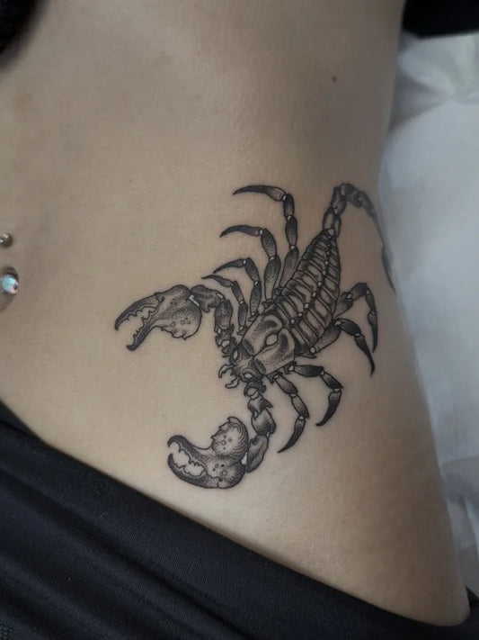 Small Black and Grey Scorpion on Women Hip Tattoo by @hendon_art
