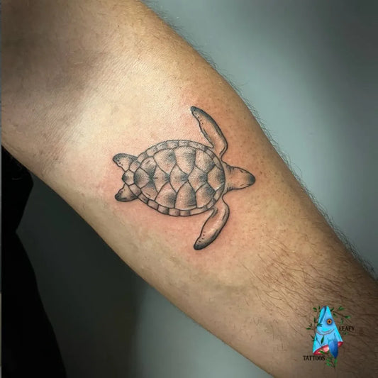 Small Black and Grey Sea Turtle Tattoo on Men Arm by @leafytattoos