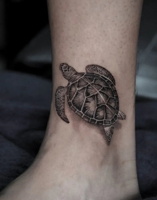 Small Black and Grey Sea Turtle Tattoo on Women Ankle by @linyurentattoo