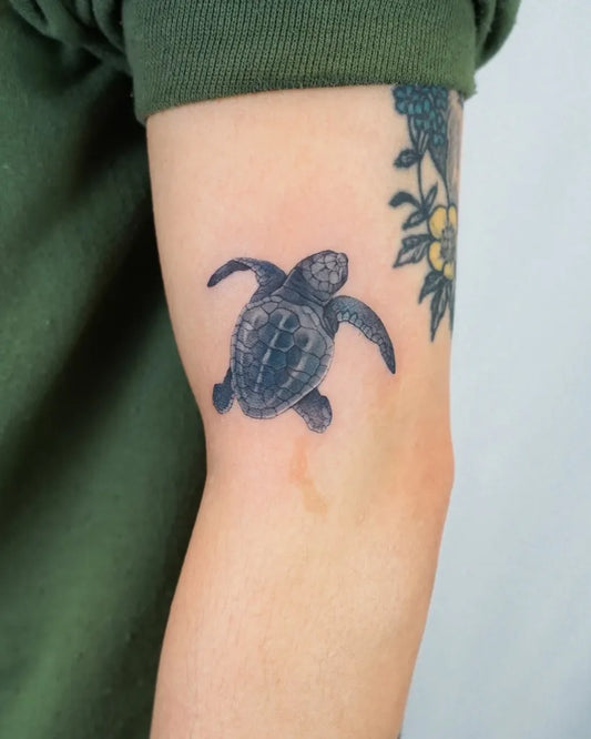 Small Black and Grey Sea Turtle Tattoo on Women Arm by @jennyli_tattoo
