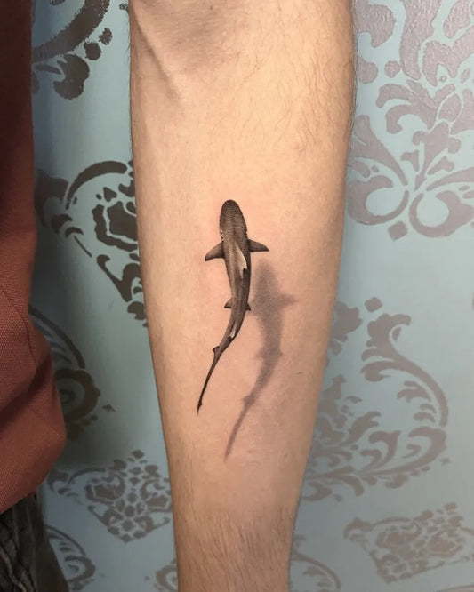 Small Black and Grey Shark with Shadow on Men Arm Tattoo by @icontattoomilano