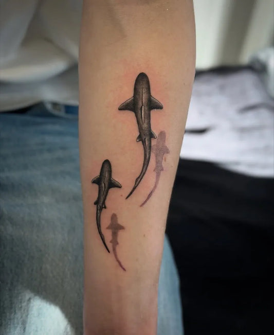 Small Black and Grey Sharks on Men Arm Tattoo by @tudor.tatts