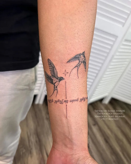 Small Black and Grey Sparrow Script Tattoo on Men Arm by @tattoology_studio