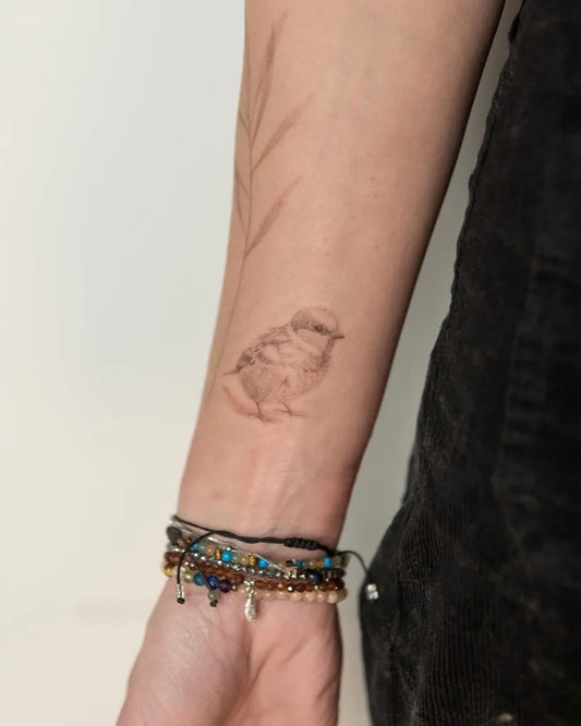 Small Black and Grey Sparrow and Branch Tattoo on Women Arm by @bymosler