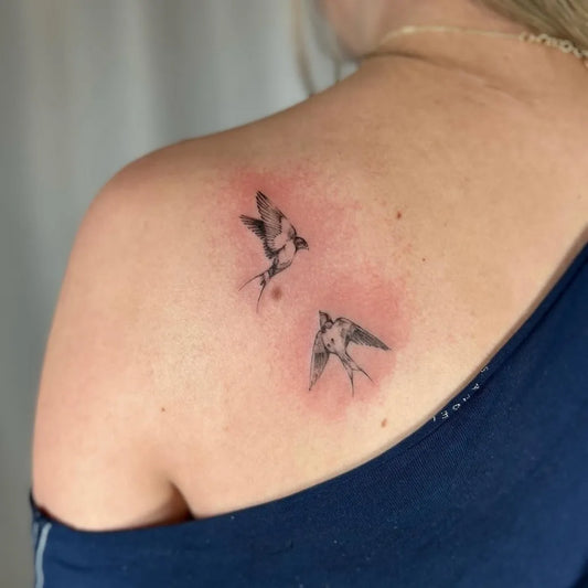 Small Black and Grey Sparrows Tattoo on Women Shoulder by @cozytattoo