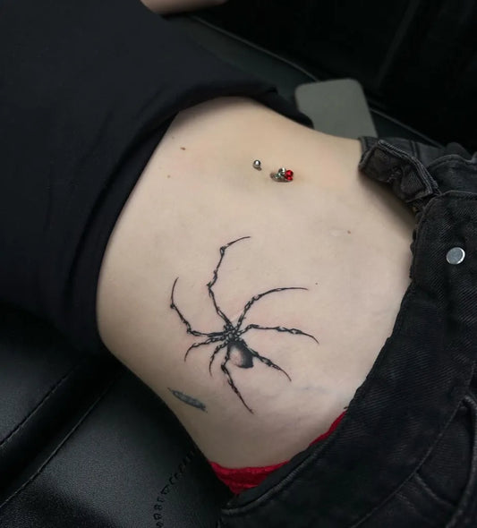 Small Black and Grey Spider on Women Hip Tattoo by @_plague_ink_