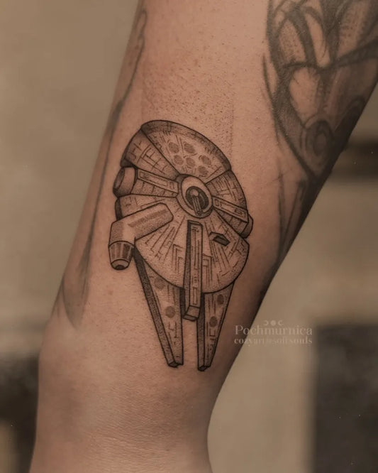 Small Black and Grey Star Wars Millennium Falcon Tattoo on Men Arm by @pochmurnica