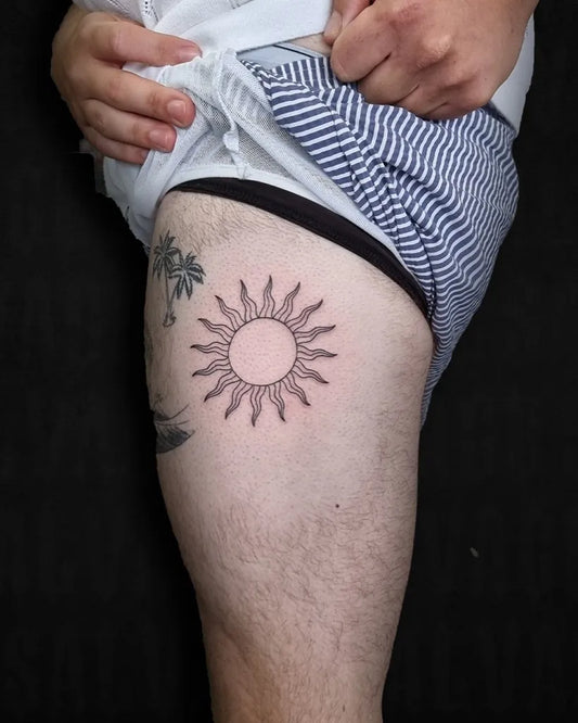 Small Black and Grey Sun Palm on Men Thigh Tattoo by @salvagetattoo