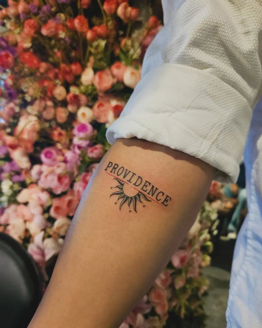 Small Black and Grey Sun and Providence Women Arm Tattoo by @hello.anshull