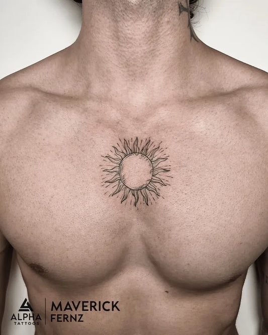 Small Black and Grey Sun on Men Chest Tattoo by @alphatattooindia
