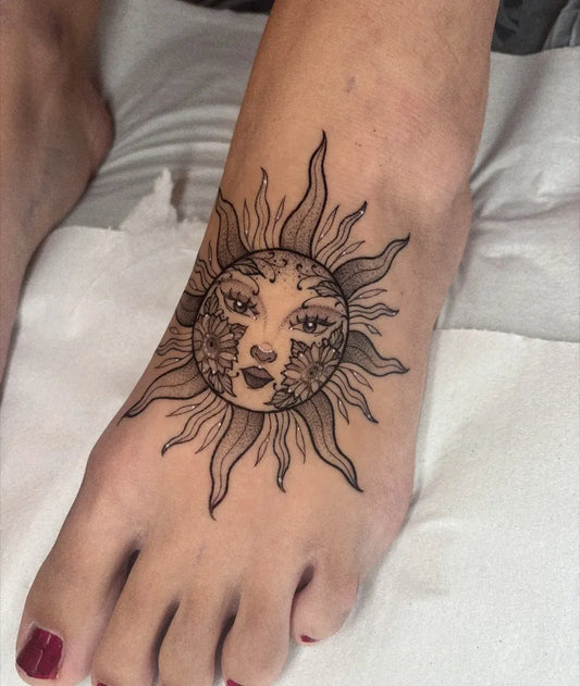 Small Black and Grey Sun with Face on Women Foot Tattoo by @katttattoo
