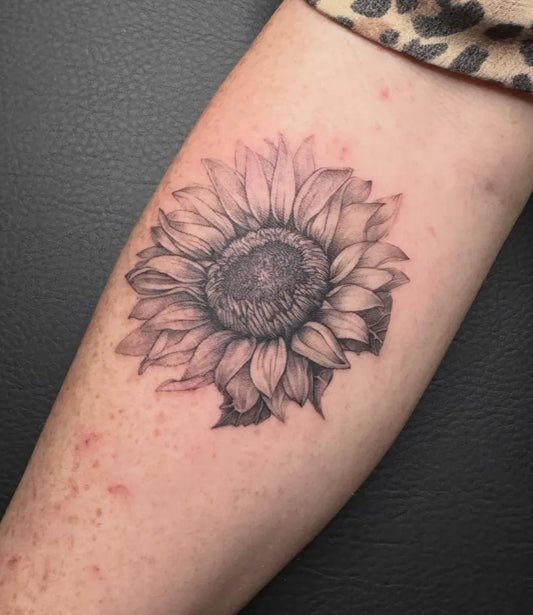 Small Black and Grey Sunflower on Women Arm Tattoo by @pigmentstoerung_pritzwalk