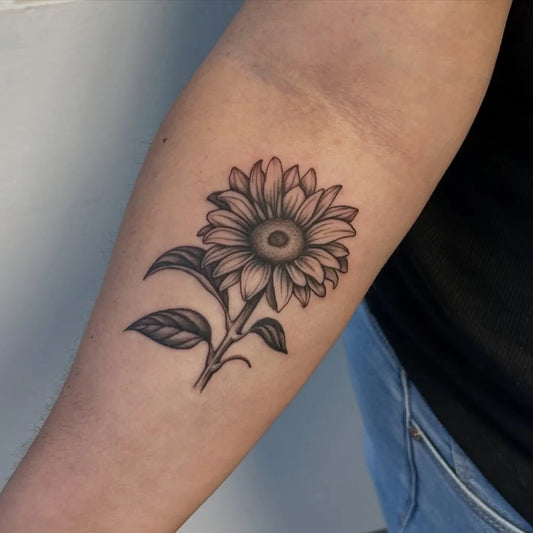 Small Black and Grey Sunflower on Women Arm Tattoo by @sierahskyetattoos