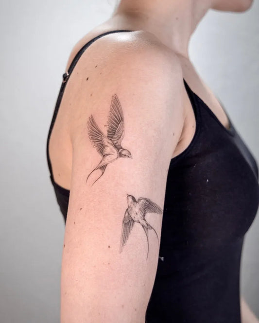 Small Black and Grey Swallow Birds Tattoo on Women Arm by @tattoo.loes