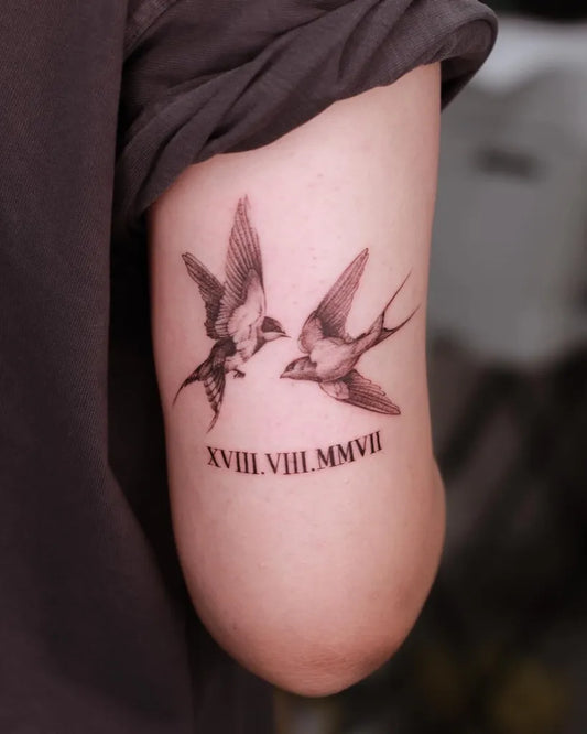 Small Black and Grey Swallow Birds and Roman Numerals Tattoo on Women Arm by @78ink_pytattoo
