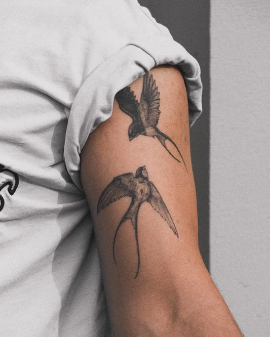 Small Black and Grey Swallow Tattoo on Men Arm by @veres.hagin