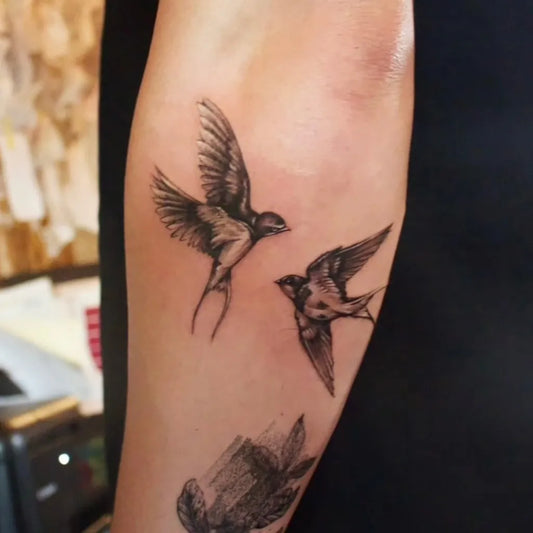 Small Black and Grey Swallow Tattoo on Women Arm by @ajito.osaka.tattoo