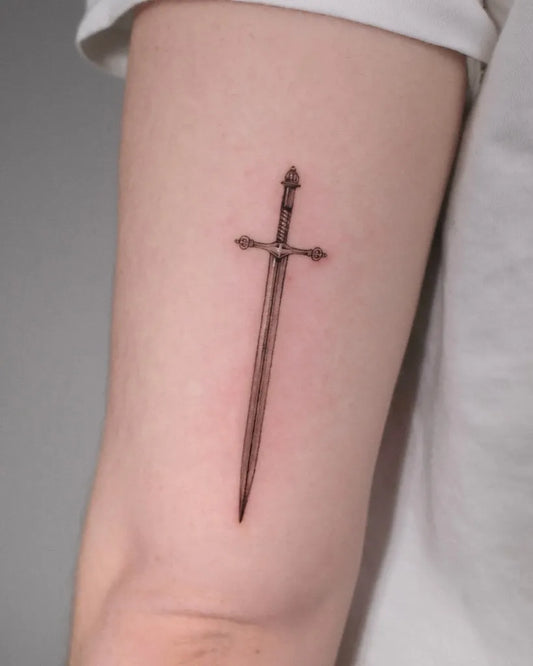 Small Black and Grey Sword Tattoo on Men Arm by @its.freegee