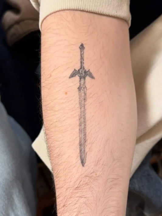 Small Black and Grey Sword on Men Arm Tattoo by @im.vulgar