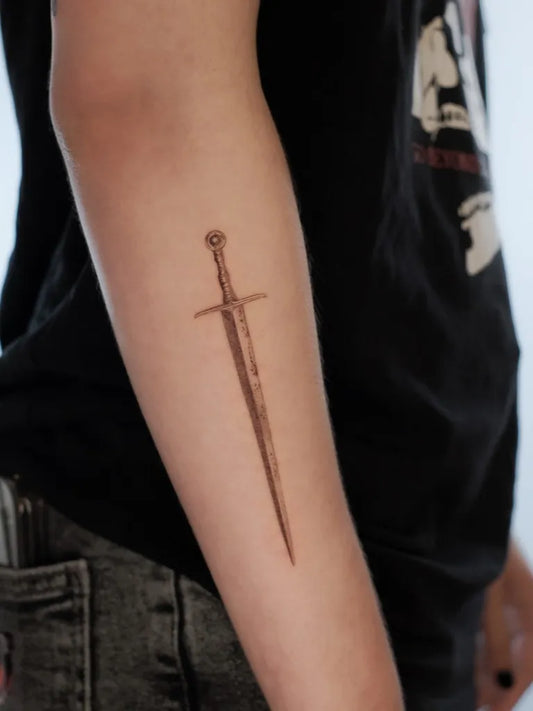 Small Black and Grey Sword on Men Arm Tattoo by @iritattooo