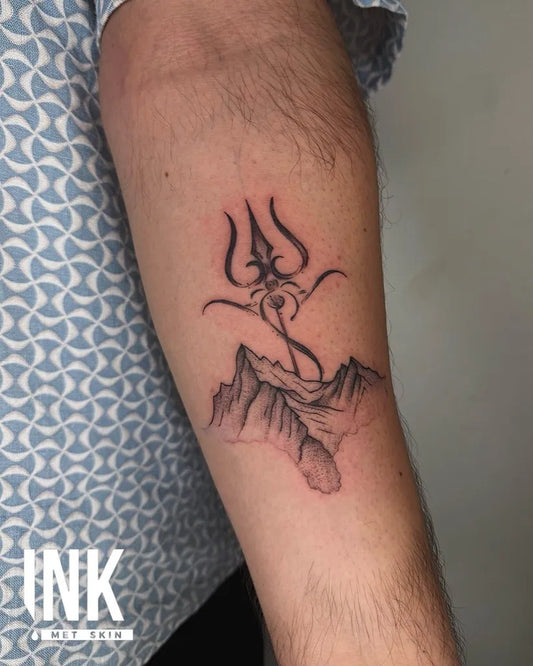 Small Black and Grey Trishul and Mountain Tattoo on Men Arm by @inkmetskintattoos