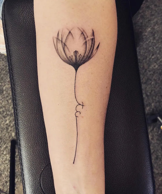 Small Black and Grey Tulip Tattoo on Women Arm by @kendallbitton