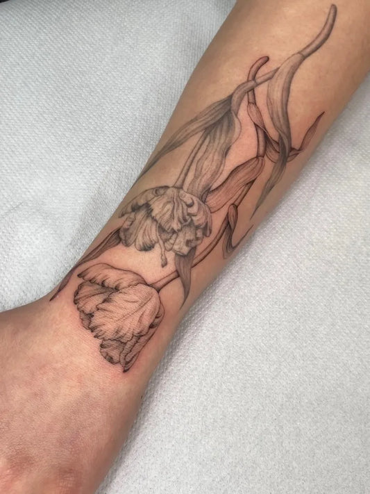 Small Black and Grey Tulip and Stems Tattoo on Women Forearm by @heloisegeslain