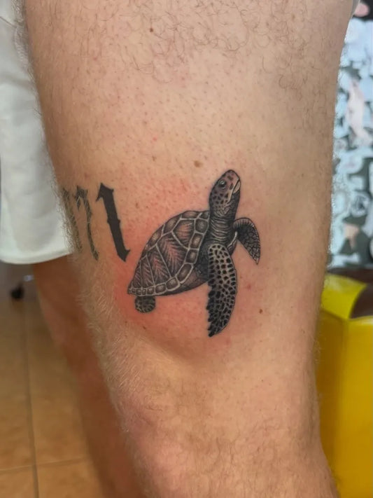 Small Black and Grey Turtle Tattoo on Men Thigh by @imperial_bambootattoo