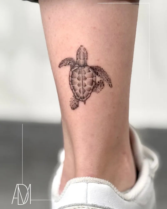 Small Black and Grey Turtle Tattoo on Women Ankle by @admtattoo