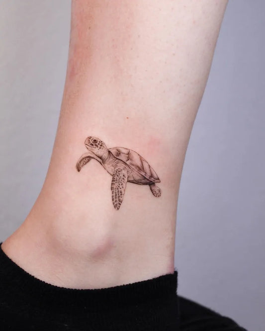 Small Black and Grey Turtle Tattoo on Women Ankle by @redhaare