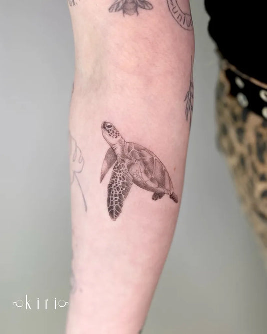 Small Black and Grey Turtle Tattoo on Women Arm by @kiri.vrs