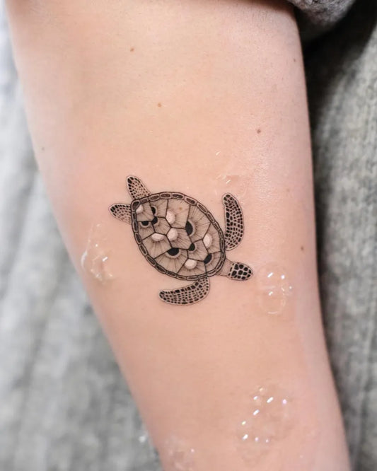 Small Black and Grey Turtle Tattoo on Women Arm by @nastyafox