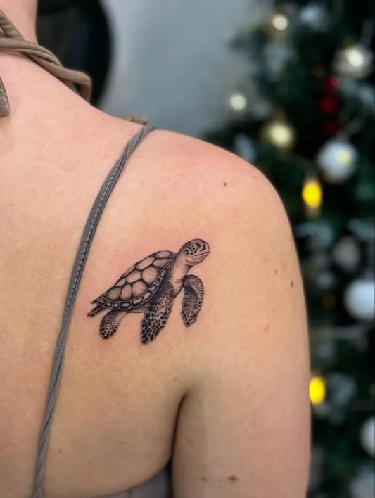 Small Black and Grey Turtle Tattoo on Women Shoulder by @waspink_tattoo
