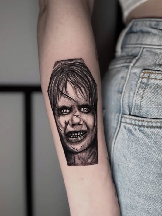 Small Black and Grey Twisty Haired Girl in Coffin Horror Tattoo on Women Arm by @marthyluck