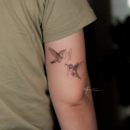 Small Black and Grey Two Hummingbirds on Women Arm Tattoo by @olgacaca