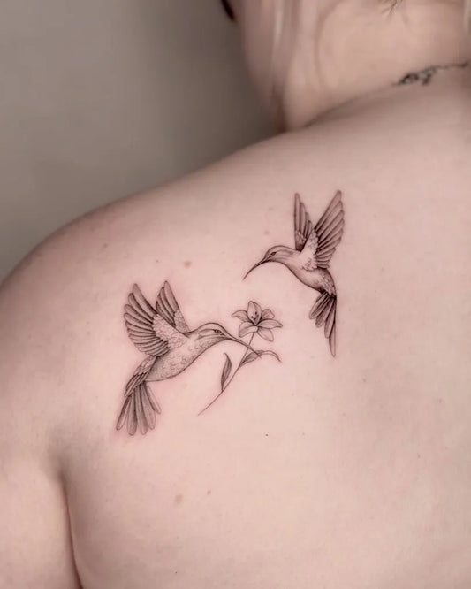 Small Black and Grey Two Hummingbirds with Flower on Women Shoulder Tattoo by @bluebell.tatts