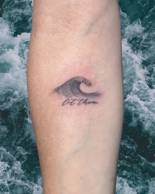 Small Black and Grey Wave and Script Tattoo on Women Forearm by @mr.inkwells