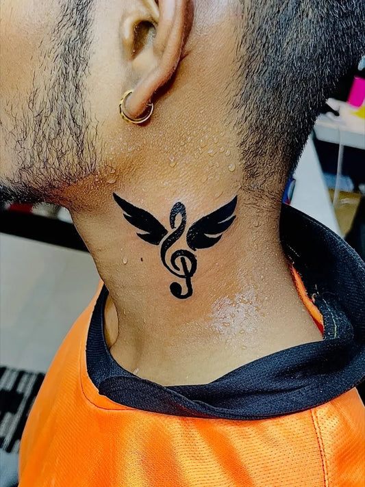Small Black and Grey Winged Musical Note Tattoo on Men Neck by @nesh_tattoos