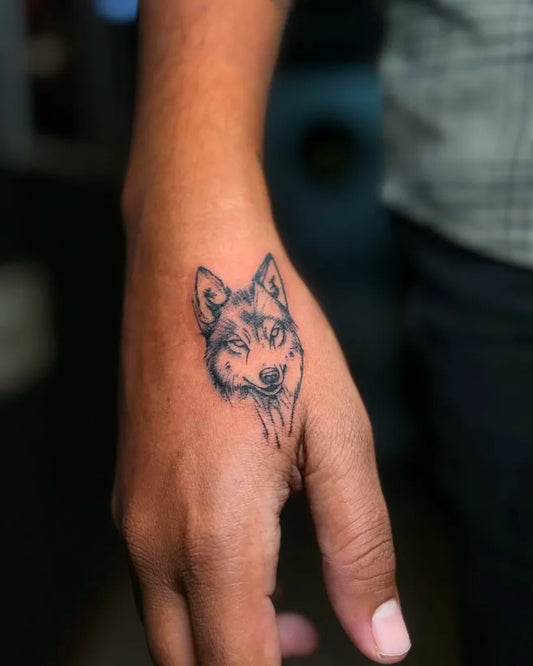 Small Black and Grey Wolf Head on Men Hand Tattoo by @bio_tattoos