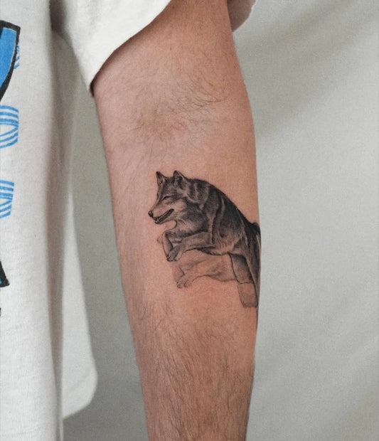 Small Black and Grey Wolf on Men Arm Tattoo by @cels.tattoo